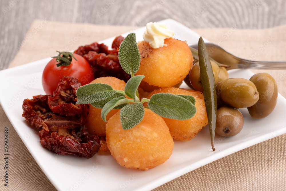Appetizer with tomato, mozzarella and olives Appetizer with tomato, mozzarella and olives