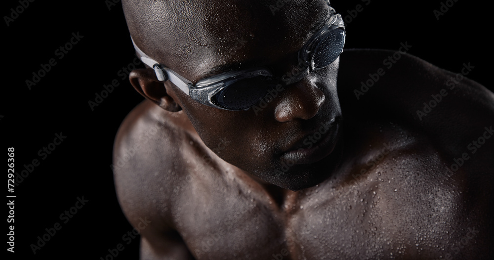 Professional swimmer looking over shoulder Professional swimmer looking over shoulder
