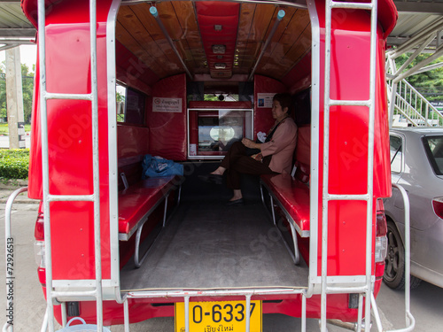 the asian tourist on the red minibus which is the main transport photo