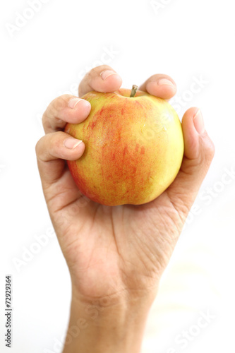 Woman hand holding red apple.