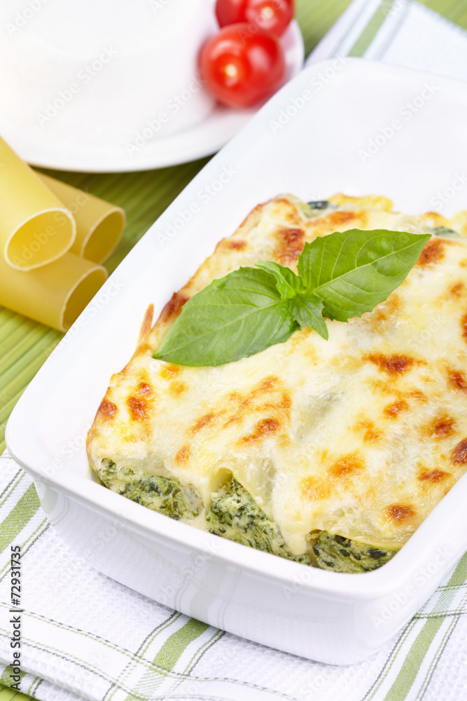 Cannelloni with spinach and ricotta baked in sauce bechamel Cannelloni with spinach and ricotta baked in sauce bechamel