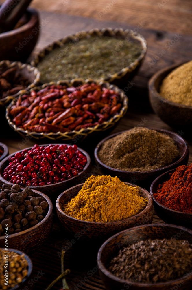 Traditional Asian concept with spices in wooden bowls