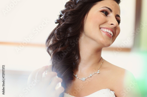 Beautiful bride to be applying make up happy smile wedding