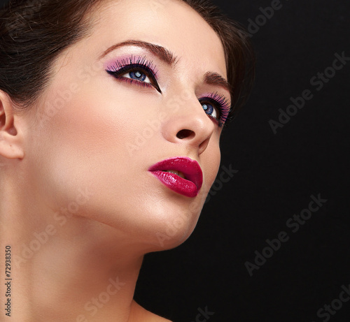 Chic woman face makeup. Long lashes and gloss lipstick. Closeup