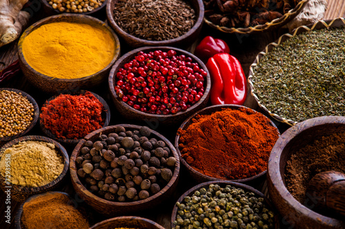 Oriental hot spices on wooden table