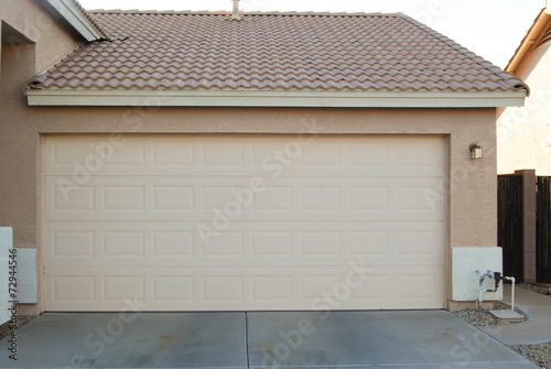 Concept of closing garage door upon leaving house.