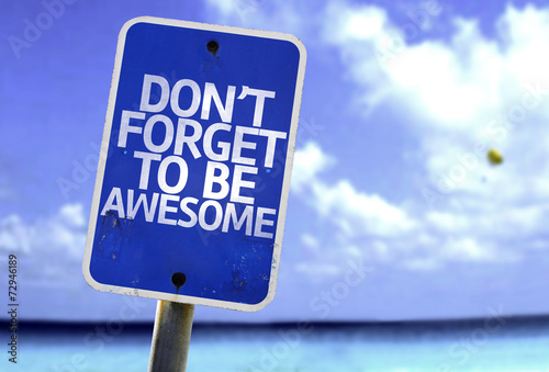 Don't Forget to Be Awesome sign with a beach on background photo