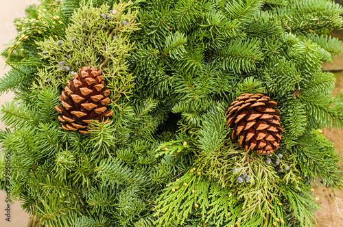 Evergreen wreath with pine cones and cedar