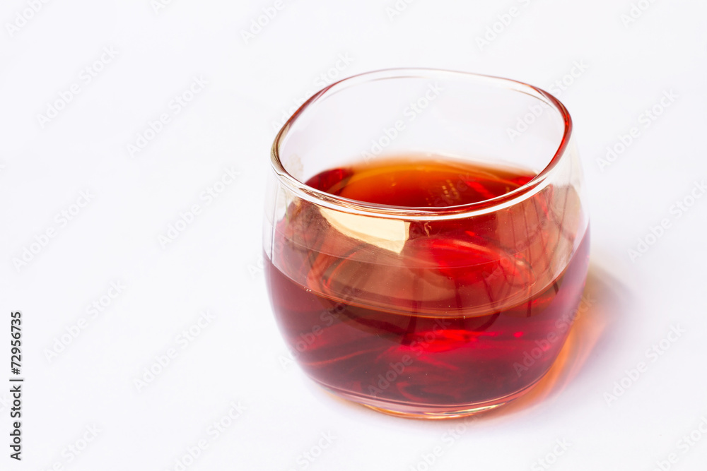 Tea in a glass on a white background. Tea in a glass on a white background.