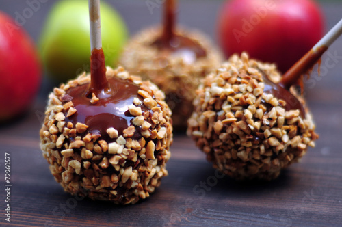 Apples in caramel with peanuts coating closeup