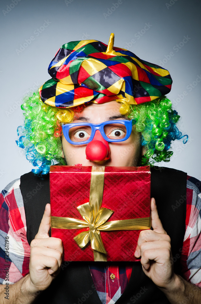 Funny clown with red giftbox Funny clown with red giftbox