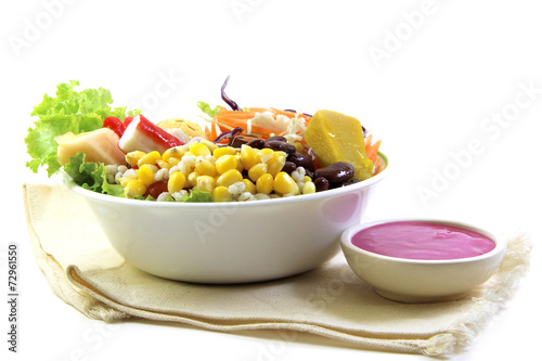 Fresh vegetable salad and salad cream on cotton cloth