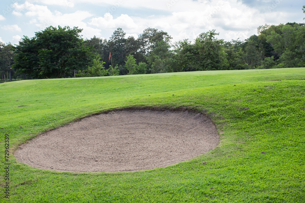 golf course with sand bunker and green grass golf course with sand bunker and green grass