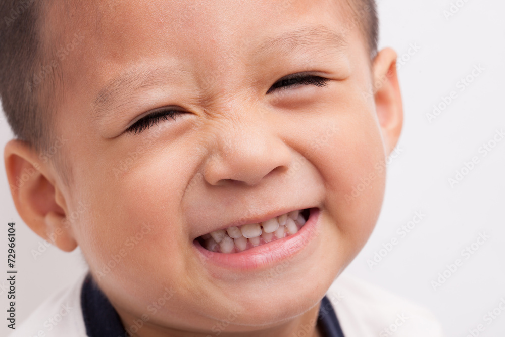 A Chinese boy closeup isolated on white background. A Chinese boy closeup isolated on white background.