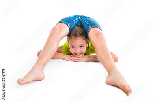 Flexible contortionist kid girl playing on white photo