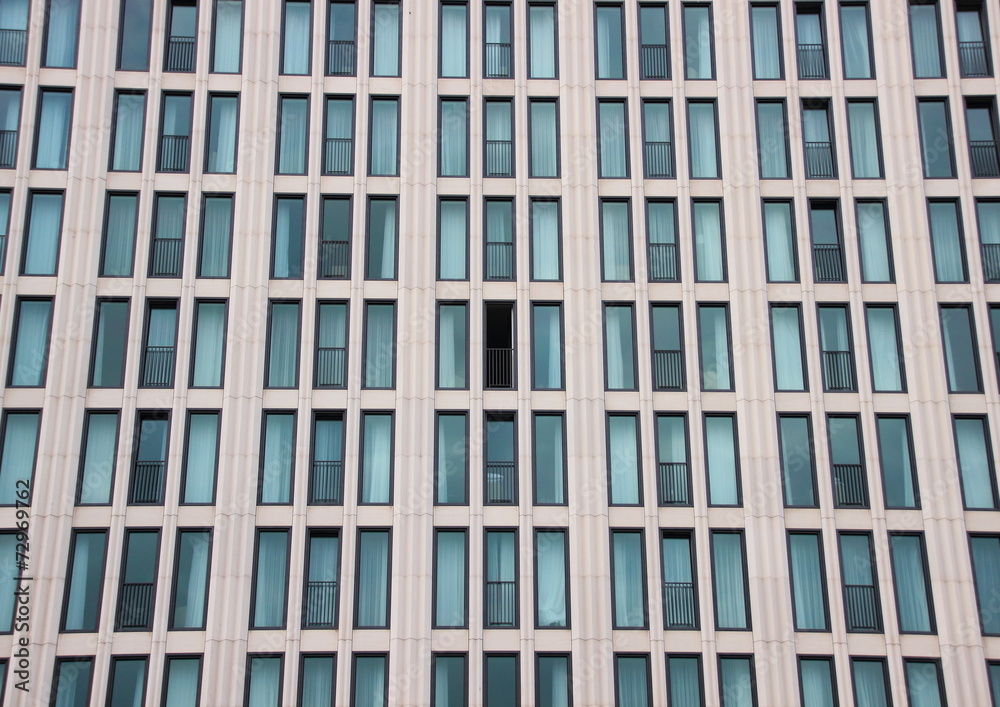 Modern building facade with one open window