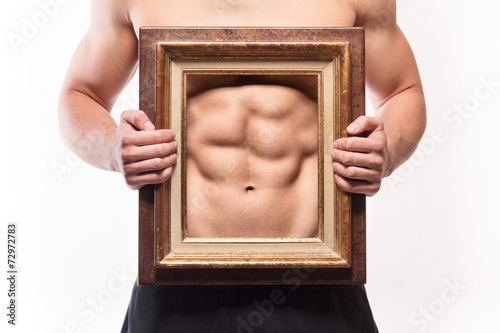 Muscular man with six-pack and frame on his torso фототапет