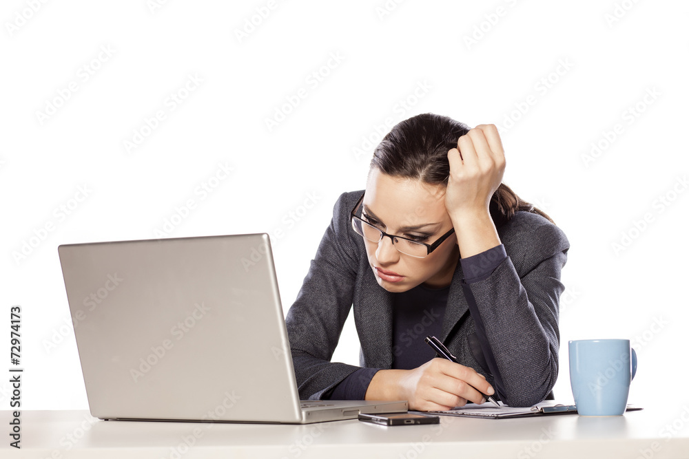very sleepy and tired business woman on laptop