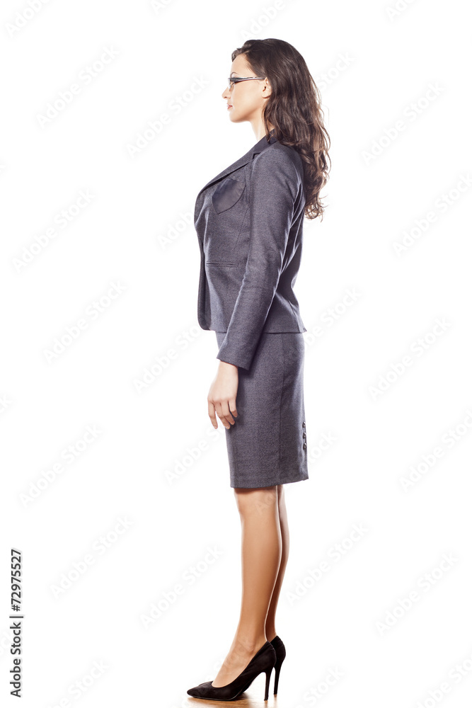 Side view of pretty business woman standing on white background Side view of pretty business woman standing on white background