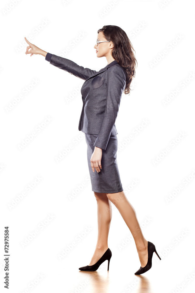 serious young beautiful business woman pointing at blank serious young beautiful business woman pointing at blank