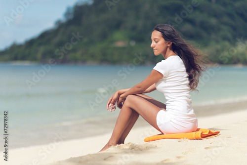 Young Woman Unwinding at Beautiful Beach