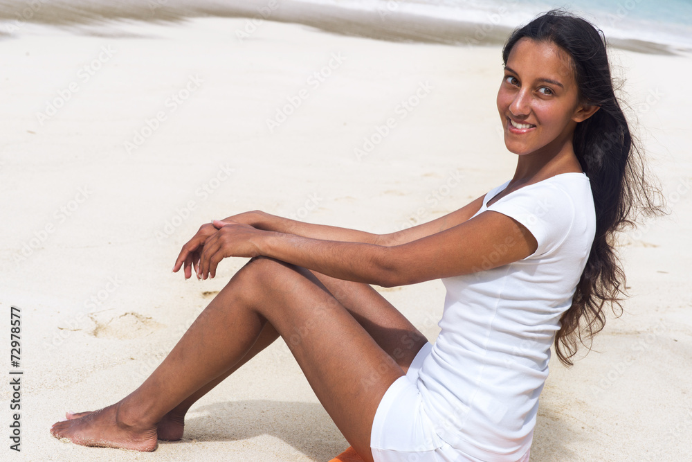 Smiling Asian Indian Woman Resting on Beach Sand Smiling Asian Indian Woman Resting on Beach Sand