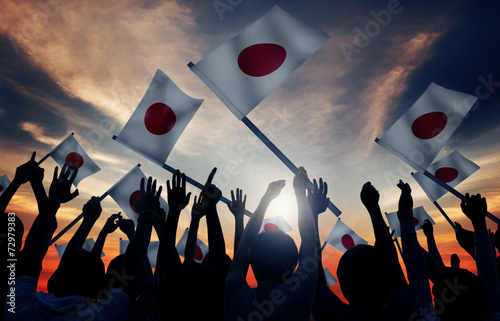 Group of People Waving Japanese Flags