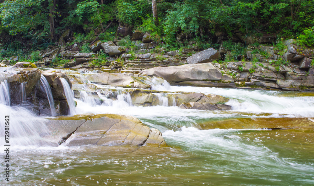Beautiful scenery with river at mountains and little waterfall