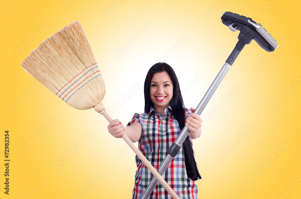 Young housewife doing housekeeping on white Young housewife doing housekeeping on white
