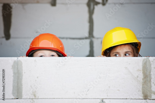 boy and girl playing on construction site