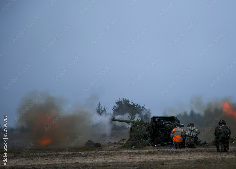Fototapeta premium shot of artillery fire with flash