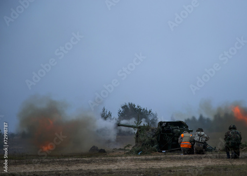 shot of artillery fire with flash