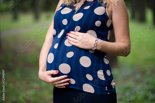 pregnancy. pregnance woman with flower photo