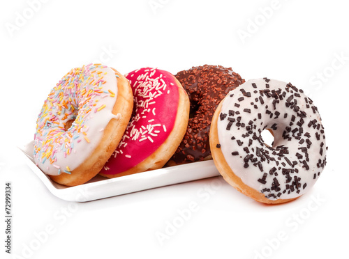 Photo Four donuts and saucer isolated
