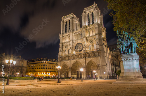 Night view on illuminated Notre Dame cathedral in Paris
