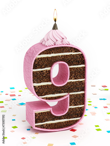 Number 9 shaped chocolate birthday cake with lit candle