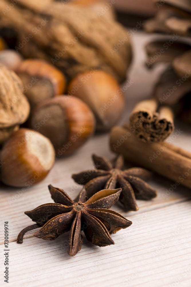 Different kinds of spices, nuts and dried oranges - christmas de Different kinds of spices, nuts and dried oranges - christmas de