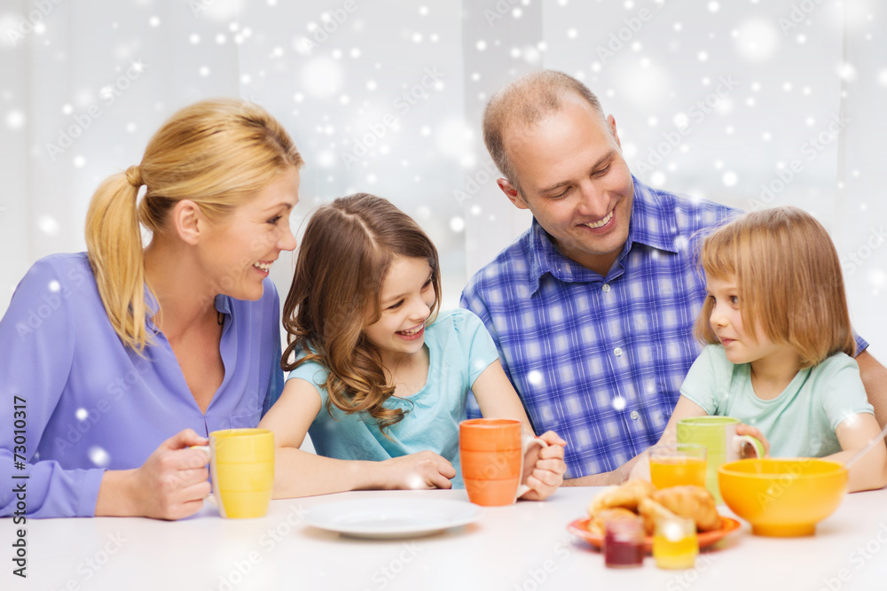 happy family with two kids having breakfast