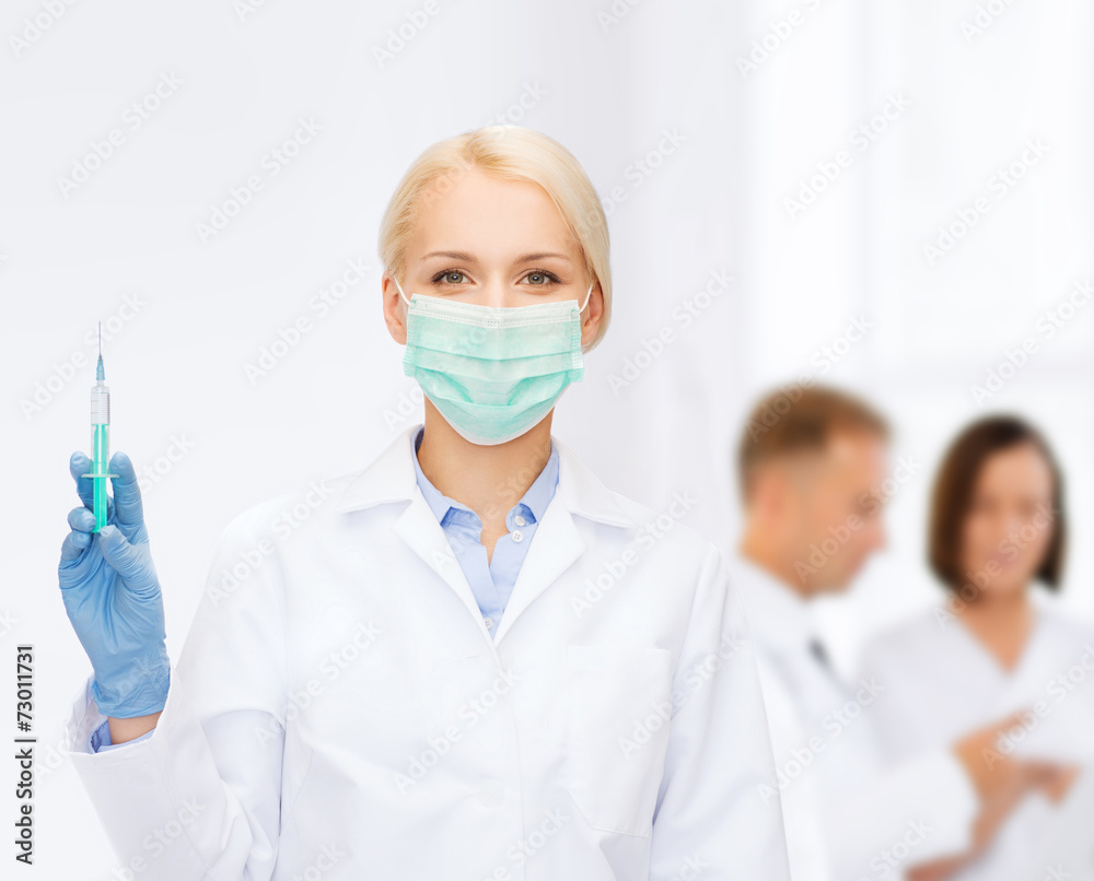 doctor in mask holding syringe with injection