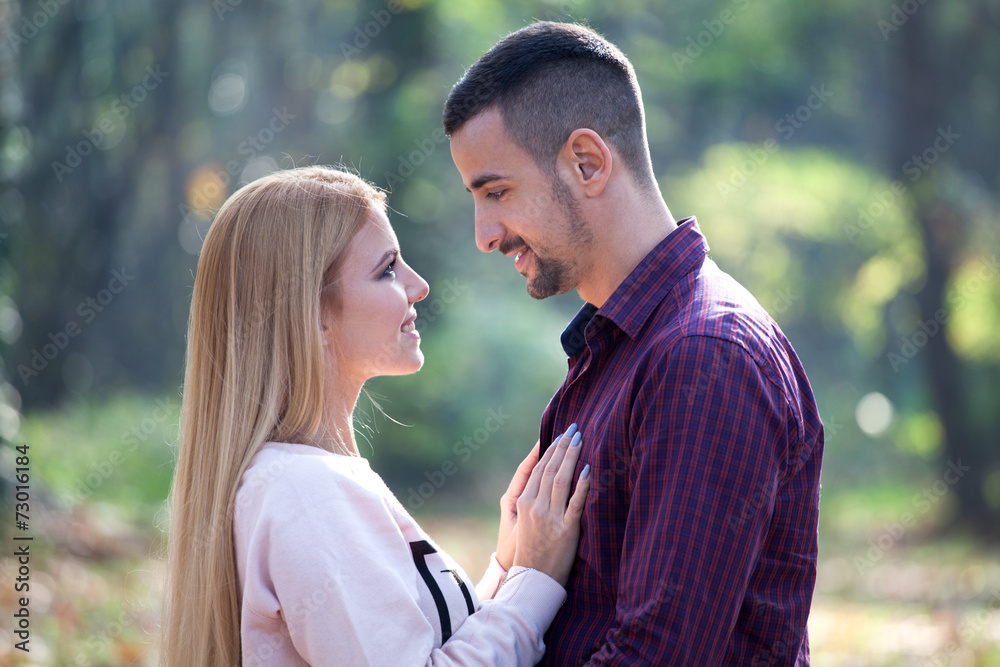Fototapeta premium Young couple in autumn park
