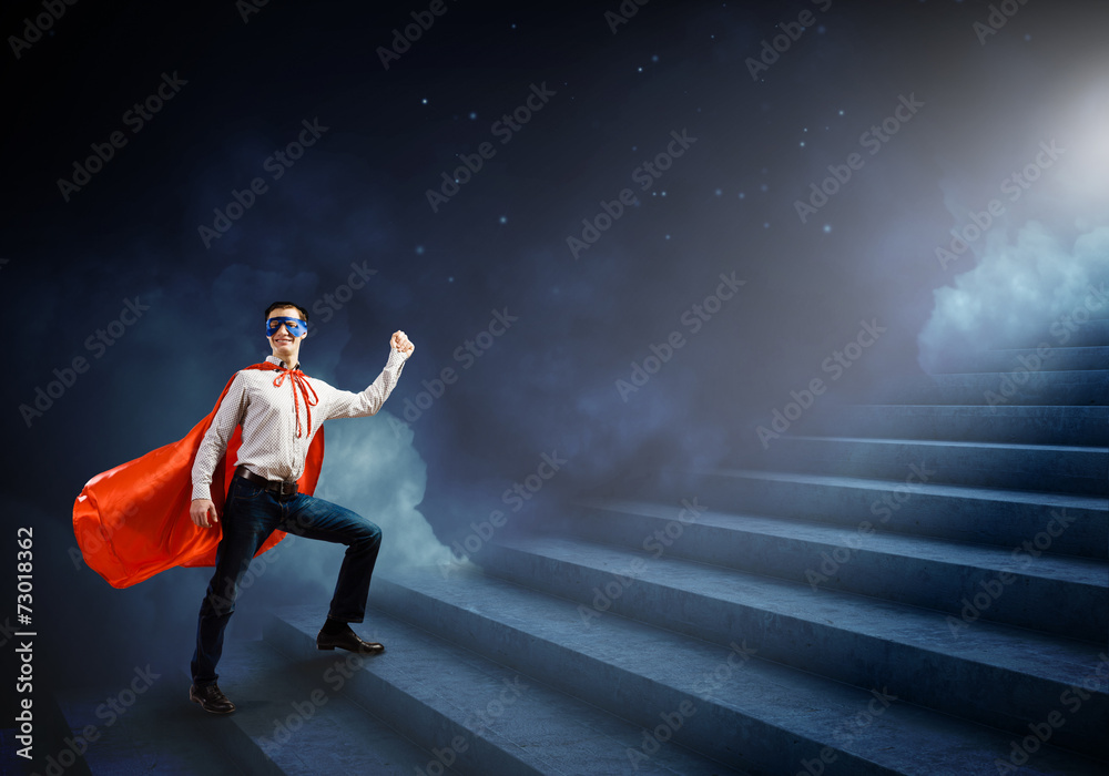 Fototapeta premium Superman on ladder