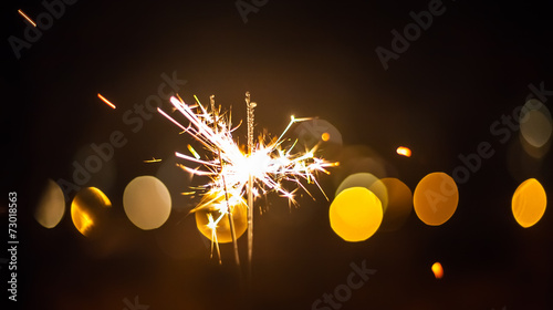 Sparkler and colorful bokeh christmas
