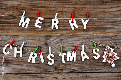 Obraz na płótnie Merry Christmas greeting message on wooden background w salonie
