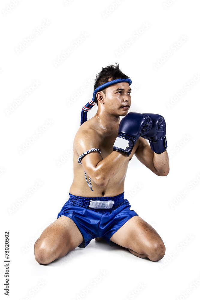 Thai boxer with thai boxing action, isolated on white background Thai boxer with thai boxing action, isolated on white background