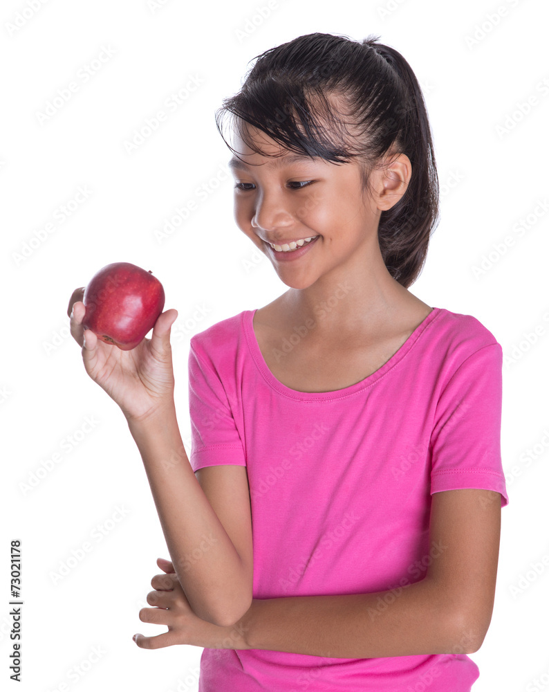 Young Asian Malay teenager with a red apple Young Asian Malay teenager with a red apple
