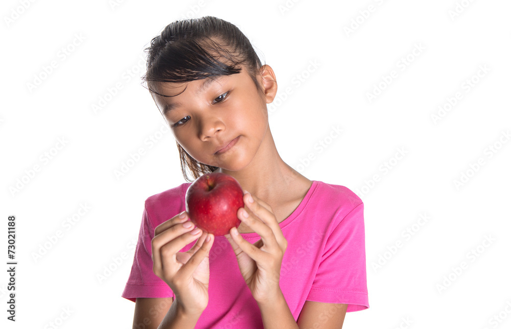 Young Asian Malay teenager with a red apple Young Asian Malay teenager with a red apple