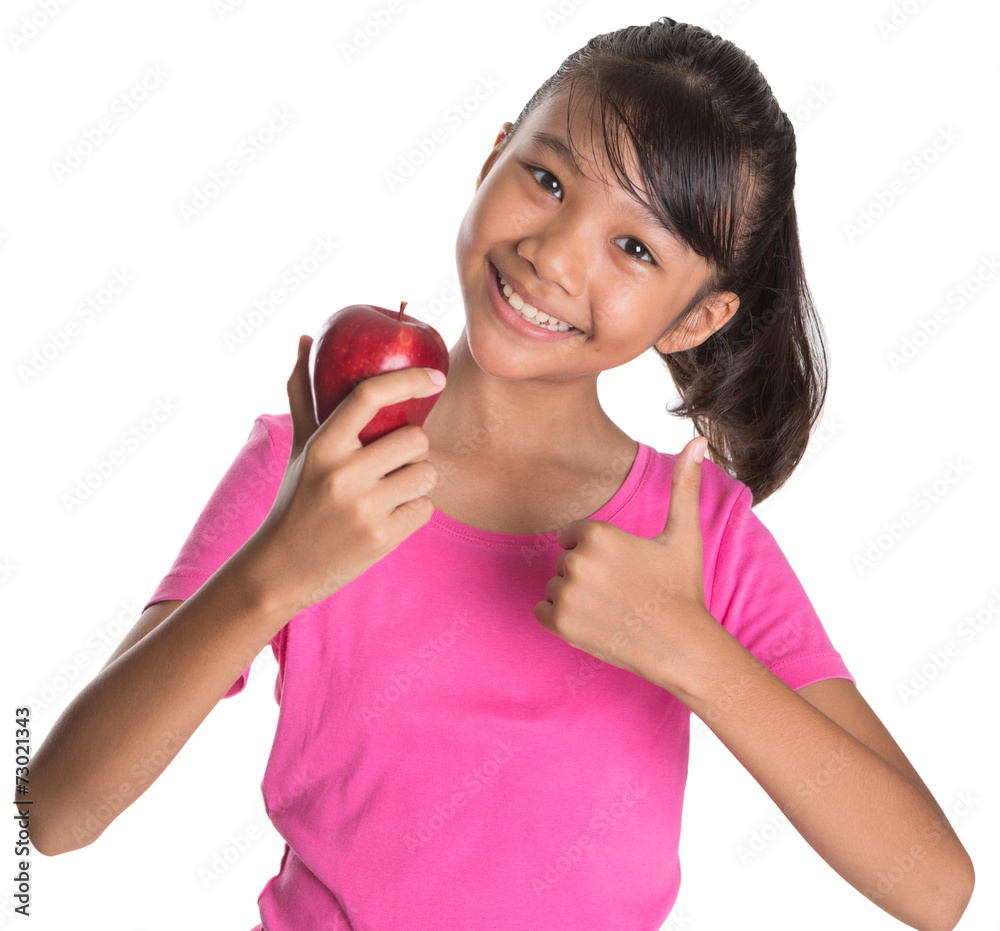 Young Asian Malay teen showing a thumbs up sign with a red apple Young Asian Malay teen showing a thumbs up sign with a red apple