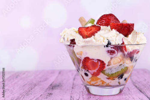 Fototapeta Naklejka Na Ścianę i Meble -  Fresh fruits salad with ice cream in bowl