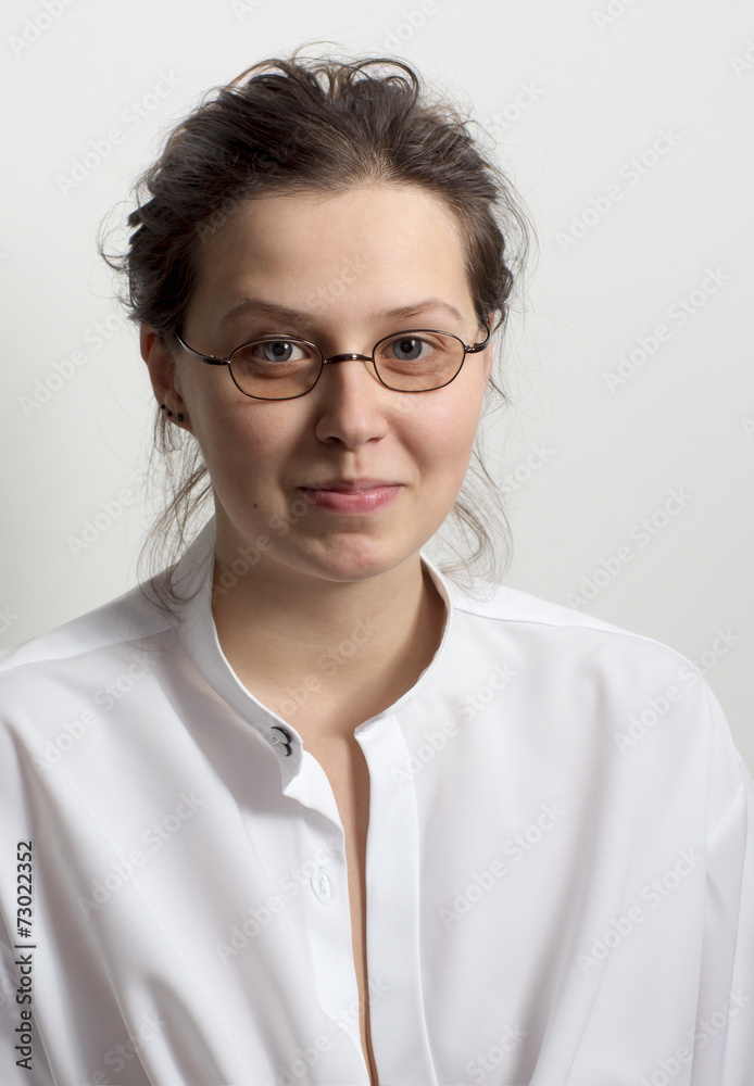 Young smiling woman with glasses