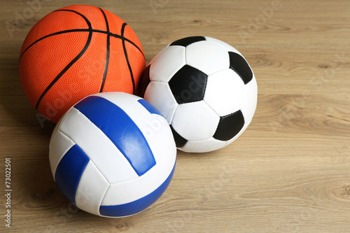 Sports balls on wooden background